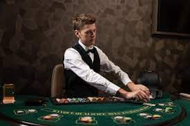 vio77maxwin app running on mobile phone showing live blackjack table and sportsbook menu